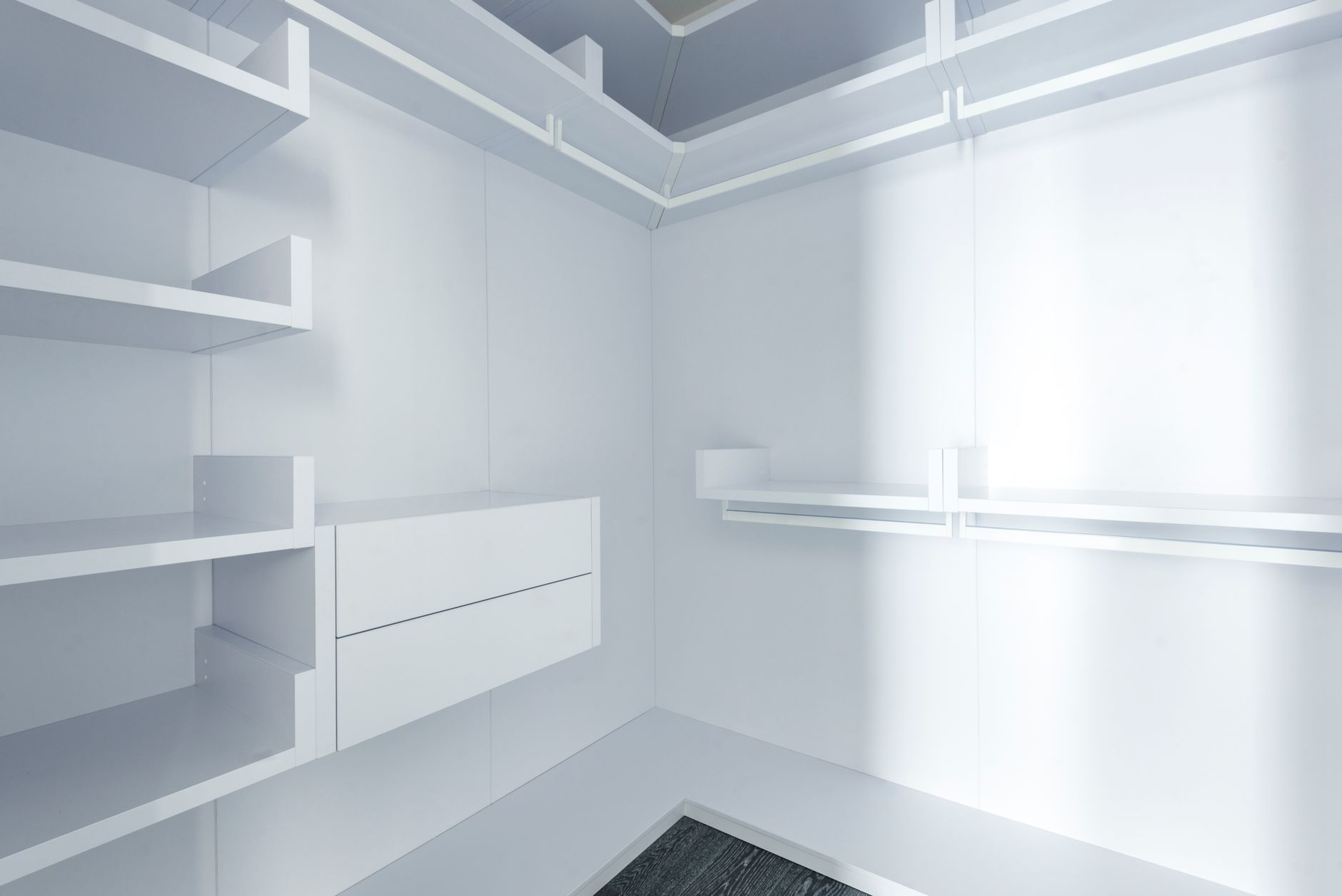 Empty white built-in shelving